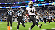 Kamara walking into the end zone in a win at Carolina