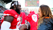 Dianna Russini working as a sideline reporter. 