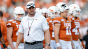 Tom Herman coaches Texas against Oklahoma State