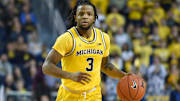 Star point guard Zavier Simpson was reportedly suspended for wrecking the car of Michigan's AD