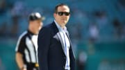 Howie Roseman on the field before a Eagles game with the Dolphins
