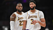 LeBron James, left, and Anthony Davis, right, share a word in between possessions. 
