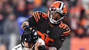 Browns defensive end Myles Garrett grabs Steelers quarterback Mason Rudolph