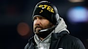 Steelers quarterback Ben Roethlisberger watches from the sideline with a headset during a game against the Browns.