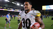 Steelers running back James Conner walks off the field with the game ball after a road win over the Chargers.