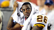 The Justice Department has charged former NFL running back Clinton Portis for three crimes.