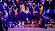 The Lakers watch the video board's tribute to Kobe Bryant before a game against the Trail Blazers.