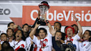River Plate's Ariel Ortega (C) holds up