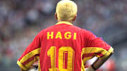 Romanian midfielder Gheorghe Hagi holds the ball o
