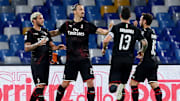 Milan celebrate during their draw at Napoli