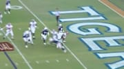 Najee Harris dives over the goal line to put Alabama in front of Auburn on the road