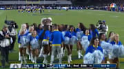Los Angeles Rams cheerleaders run off the field after lingering around too long