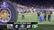 A fan at the Quick Lane Bowl in Detroit showed off his sidearm abilities. They weren't great.