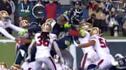 Marshawn Lynch dives over the line of scrimmage for a touchdown in his return game for the Seahawks.