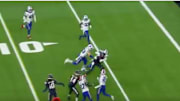 Houston Texans QB Deshaun Watson carries two Buffalo Bills defenders into the end zone. 