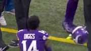Vikings WR Stefon Diggs tossing his helmet in frustration. 