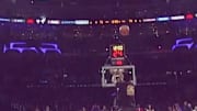 An incredible shot from a Los Angeles Lakers fan which netted him $100,000.