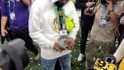Odell Beckham Jr. spreads a stack of cash before handing some to LSU junior Justin Jefferson