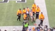 XFL fan streaks on the field during New York Guardians first home game.