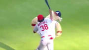 Jose Martinez  of the St. Louis Cardinals beat Atlanta Braves mascot, Blooper, into submission.
