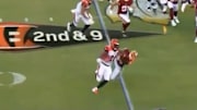 Joe Mixon crushes Josh Norman with a vicious stiff arm on Thursday.