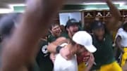 Packers swarm Aaron Rodgers after record-breaking performance against Raiders.