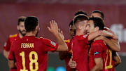 Spain players celebrate their opening goal against Switzerland