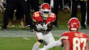 Tyreek Hill catching a pivotal deep ball by Patrick Mahomes, which helped the Chiefs win Super Bowl LIV