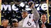 Seattle Seahawks linebacker Malcolm Smith hoists the Vince Lombardi Trophy