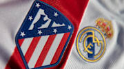 The Atlético Madrid and Real Madrid Club Badges