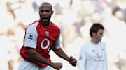 Thierry Henry celebrates against north London rivals Tottenham
