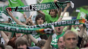 Wolfburg supporters cheer their team dur