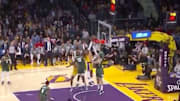 Los Angeles Lakers' LeBron James dunks over Bucks' Brook Lopez