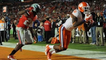 Jan 3, 2014; Miami Gardens, FL, USA; Clemson Tigers wide receiver Martavis Bryant (1) makes a touchdown catch as Ohio State Buckeyes cornerback Armani Reeves (26) defends during the second half in the 2014 Orange Bowl college football game at Sun Life Stadium. Mandatory Credit: Steve Mitchell-USA TODAY Sports