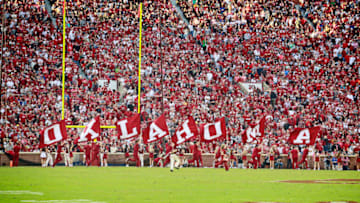 NORMAN, OK - SEPTEMBER 22: Members of the Oklahoma Sooners spirit squad celebrate a touchdown against the Army Black Knights at Gaylord Family Oklahoma Memorial Stadium on September 22, 2018 in Norman, Oklahoma. The Sooners defeated the Black Knights 28-21 in overtime. (Photo by Brett Deering/Getty Images)