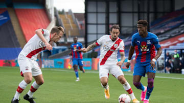 LONDON, ENGLAND - SEPTEMBER 12: Wilfried Zaha of Crystal Palace and James Ward-Prowse and Danny Ings of Southampton in action during the Premier League match between Crystal Palace and Southampton at Selhurst Park on September 12, 2020 in London, United Kingdom. (Photo by Sebastian Frej/MB Media/Getty Images)