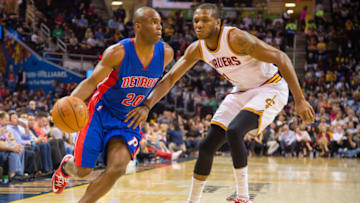 CLEVELAND, OH - APRIL 13: Jodie Meeks #20 of the Detroit Pistons drives around James Jones #1 of the Cleveland Cavaliers during the first half at Quicken Loans Arena on April 13, 2014 in Cleveland, Ohio. NOTE TO USER: User expressly acknowledges and agrees that, by downloading and or using this photograph, User is consenting to the terms and conditions of the Getty Images License Agreement. (Photo by Jason Miller/Getty Images)