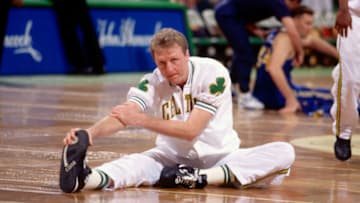 BOSTON, MA - 1992: Larry Bird #33 of the Boston Celtics stretches before a game played in 1992 at the Boston Garden in Boston, Massachusetts. NOTE TO USER: User expressly acknowledges and agrees that, by downloading and/or using this Photograph, user is consenting to the terms and conditions of the Getty Images License Agreement. Mandatory Copyright Notice: Copyright 1992 NBAE (Photo by Dick Raphael/NBAE via Getty Images)