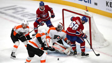 Apr 21, 2022; Montreal, Quebec, CAN; Philadelphia Flyers goaltender Martin Jones (35) makes a save against Montreal Canadiens defenseman David Savard (58) during the second period at Bell Centre. Mandatory Credit: Jean-Yves Ahern-USA TODAY Sports