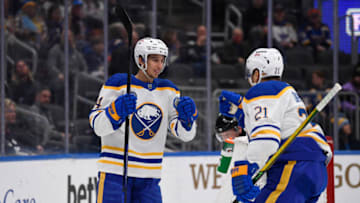 Feb 25, 2022; St. Louis, Missouri, USA; Buffalo Sabres center Dylan Cozens (24) is congradulated by right wing Kyle Okposo (21) after scoring a goal against the St. Louis Blues during the first period at Enterprise Center. Mandatory Credit: Jeff Le-USA TODAY Sports
