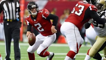 Sep 7, 2014; Atlanta, GA, USA; Atlanta Falcons quarterback Matt Ryan (2) avoids the New Orleans Saints pass rush during the first half at the Georgia Dome. The Falcons defeated the Saints 37-34 in overtime. Mandatory Credit: Dale Zanine-USA TODAY Sports