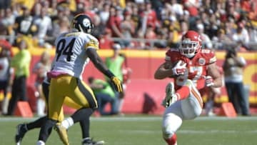 Oct 25, 2015; Kansas City, MO, USA; Kansas City Chiefs tight end Travis Kelce (87) catches a pass and is chased by Pittsburgh Steelers inside linebacker Lawrence Timmons (94) during the second half at Arrowhead Stadium. The Chiefs won 23-13. Mandatory Credit: Denny Medley-USA TODAY Sports