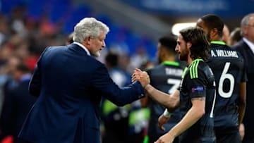 Mark Hughes congratulates Joe Allen, one of his summer signings after an impressive showing for his native Wales at Euro 2016. (Photo by Stu Forster/Getty Images)