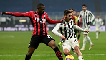 MILAN, ITALY - JANUARY 23: Pierre Kalulu of AC Milan ands Paulo Dybala of Juventus during the Italian Serie A football match between AC Milan and Juventus at San Siro Stadium in Milan, Italy on January 23, 2022. (Photo by Piero Cruciatti/Anadolu Agency via Getty Images)