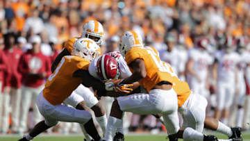 KNOXVILLE, TN - OCTOBER 20: Jaylen Waddle #17 of the Alabama Crimson Tide is tackled by Defensive back Marquill Osborne #3 of the Tennessee Volunteers and Defensive back Shawn Shamburger #12 of the Tennessee Volunteers during the game between the Alabama Crimson Tide and the Tennessee Volunteers at Neyland Stadium on October 20, 2018 in Knoxville, Tennessee. (Photo by Donald Page/Getty Images)