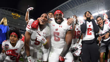 MIAMI GARDENS, FL - DECEMBER 30: Wisconsin Badgers players celebrate winning the 2017 Capital One Orange Bowl against the Miami Hurricanes at Hard Rock Stadium on December 30, 2017 in Miami Gardens, Florida. (Photo by Rob Foldy/Getty Images)