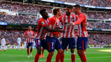 MADRID, SPAIN - APRIL 08: Antoine Griezmann (2ndL) of Atletico de Madrid celebrates scoring their opening goal with teammates Thomas Teye Partey (L), Diego Costa (2ndR) and Lucas Hernandez (R) during the La Liga match between Real Madrid CF and Club Atletico de Madrid at Estadio Santiago Bernabeu on April 8, 2018 in Madrid, Spain. (Photo by Gonzalo Arroyo Moreno/Getty Images)