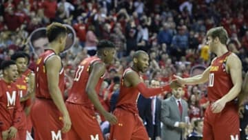 Feb 6, 2016; College Park, MD, USA; Maryland Terrapins guard Rasheed Sulaimon (0) and forward Jake Layman (10) celebrate during the second half against the Purdue Boilermakers at Xfinity Center. Maryland Terrapins defeated Purdue Boilermakers 72-61. Mandatory Credit: Tommy Gilligan-USA TODAY Sports