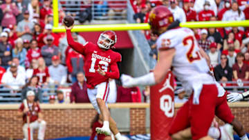 Nov 20, 2021; Norman, Oklahoma, USA; Oklahoma Sooners quarterback Caleb Williams (13) throws past Iowa State Cyclones linebacker Mike Rose (23) during the game at Gaylord Family-Oklahoma Memorial Stadium. Mandatory Credit: Kevin Jairaj-USA TODAY Sports