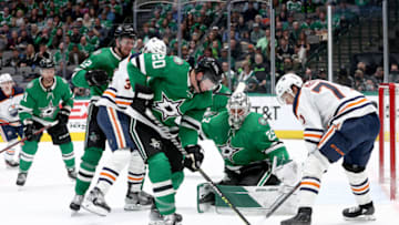 DALLAS, TEXAS - MARCH 22: Ryan Suter #20 of the Dallas Stars clears the puck against Ryan McLeod #71 of the Edmonton Oilers in the second period at American Airlines Center on March 22, 2022 in Dallas, Texas. (Photo by Tom Pennington/Getty Images)